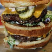 The Goliath Burger · Two 6oz Burger Patties, Lettuce, Onion, Pickle, American Cheese, and 1000 Island Aioli.