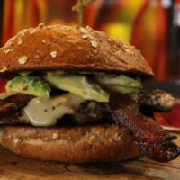Chicken Avocado Club · Wood-Fire Grilled Chicken Breast topped with Applewood Smoked Bacon, Swiss Cheese, Avocado, ...