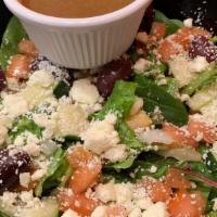 The Greek Salad · A blend of Chopped Romaine and Spring Mix tossed with Feta Cheese, Kalamata Olives, Pepperon...