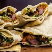 Lamb Kati Roll · Indian street food version of the burrito. Lamb Tikka cubes rolled in flat-bread with fresh ...