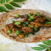 Shrimp Kati Roll · Indian street food version of the burrito. Shrimp Tikka rolled in flat-bread with fresh vegg...