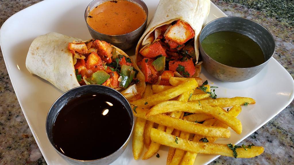 Vegetable Kati Roll · Indian street food version of the burrito. Mixed Vegetables rolled in flat-bread with fresh toppings along with perfect medley of fresh, tangy, and sweet and spicy chutneys (sauces). (Vegan Option Available)