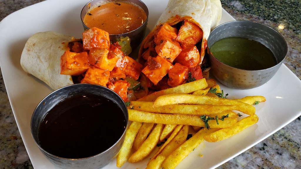 Paneer Signature Kati Roll · Indian street food version of the burrito. Cheese cubes rolled in flat-bread with Chopped Boiled Eggs & fresh veggies with a perfect medley of fresh, tangy, and sweet and spicy chutneys (sauces).