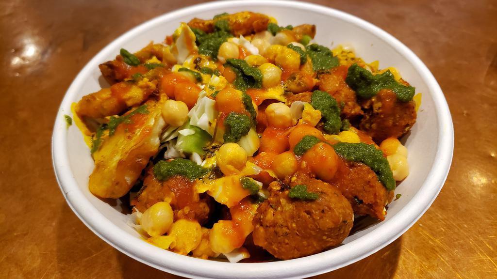 Tika Chicken Bowl · Chicken Tikka Cubes with fresh veggies with a perfect medley of fresh, tangy, and sweet and spicy chutneys (sauces) on your choice of Rice or Salad