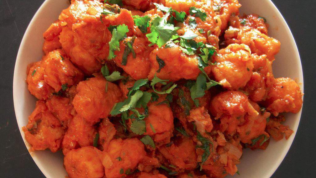 Manchurian · Manchurian is a popular battered deep fried medium spicy Chicken-Paneer-Cauliflower appetizer that originated in Kolkata. This immensely popular Indian appetizer is stir fried with Manchurian Sauce