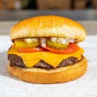 Cheeseburger · Ketchup, mustard, tomatoes, onions, pickles, and American cheese.