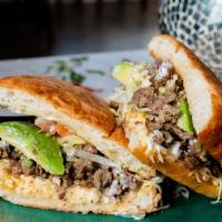 Steak (Asada) Tortas · Mexican sandwiches served with lettuce, tomato, avocado, beans, cheese & sour cream.