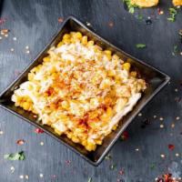 Elote · Elote server with Butter, Mayo, lime, Fresco cheese and Red Chili Powder.