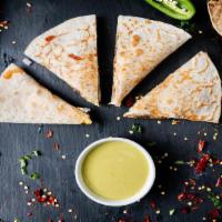Quesadilla (Pork) · Flour tortilla with grilled Pork. Served with a melted cheese.