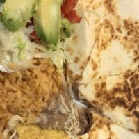 Big Quesadilla · Flour tortilla, one choice of meat, rice, beans, lettuce, tomatoes, sour cream and guac.