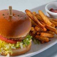 Crab Cake Sandwich · crab cake topped with remoulade sauce, served with lettuce, tomato, & onion and hand-cut fre...