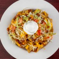 Crazy Fox Nachos · Tortilla chips piled high, topped with chili, Cheddar cheese, lettuce, and tomatoes. Served ...