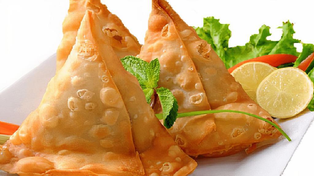 Aloo Samosa  · Delicious and crispy preparation filled with boiled potatoes and spices 3 pcs  served with mint and tamarind sauce.