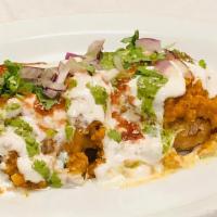 Aloo Tikki (Ragda Stuffed )  · Crispy potato patties stuffed with green peas and topped with chickpeas, yoghurt, mint sauce...