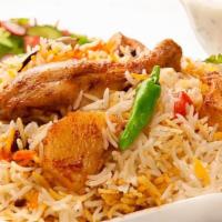 Chicken Biryani  · Basmati rice cooked with spiced chicken yoghurt and exotic spice.
