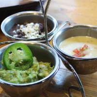 Los Tres Amigos · A sampler of our three favorites: queso fundido, guacamole, black bean dip, house made chips.