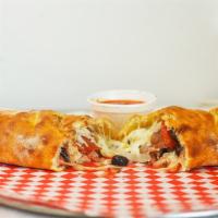 Calzone · Dough, tomato sauce, cooked ham, cheese, and mushrooms.