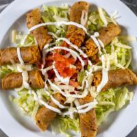 Flautas (5) · Rolled crispy corn tortillas stuffed with pollo, lettuce sour cream red tomato and cheese.