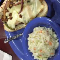 Chicken Philly · Slices of chicken grilled with onions and green peppers, smothered with swiss cheese on a to...