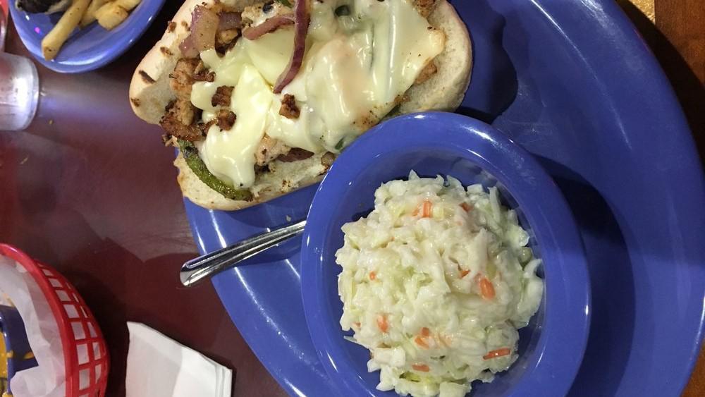 Chicken Philly · Slices of chicken grilled with onions and green peppers, smothered with swiss cheese on a toasted hoagie bun.
