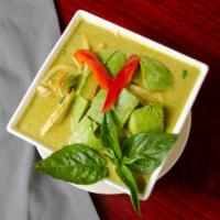 Green Curry · Slice meat in green curry w/ coconut milk, bamboo shoot, bell pepper, green bean and basil.