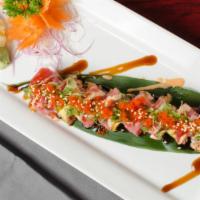 Cherry Blossom Roll · Spicy tuna, jalapeno, cilantro tapped w/ fresh tuna, avocado, masago, green onion, spicy may...