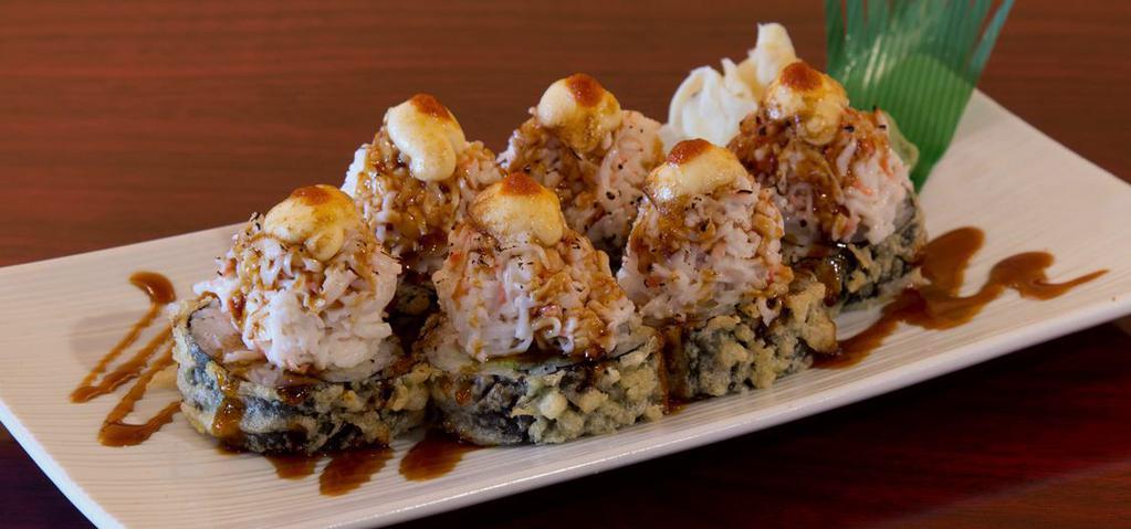 Volcano Roll · Crab meat, cream cheese, shrimp, crab stick topped with crab salad, mayo, eel sauce, hot sauce.