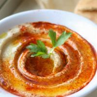Hummus (V, Can Be Gf) · extra virgin olive oil, smoked paprika, served with handmade pita bread (contains sesame)