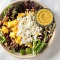 Mango Salad · Organic spring mix with sun-dried cranberries, chunks of mango, oven-roasted walnuts, and go...