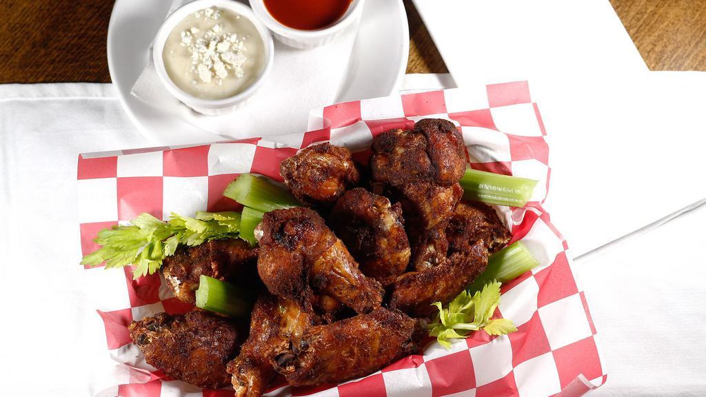 Wings · A pound of free-range chicken wings naked. Comes with Buffalo sauce and blue cheese or ranch dressing.