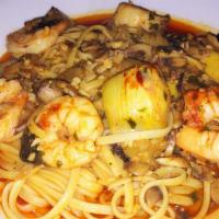 Scampi Di Cosenza · Jumbo shrimp, artichoke heats and mushrooms sautéed in oil, garlic, and white wine sauce ser...