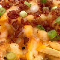 Loaded Fries Or Tots · Loaded with bacon, sour cream, scallions, olives, and cheesy goodness