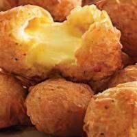 Wisconsin Cheese Curds · Original Wisconsin cheese curds served with sriracha ranch