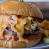 Surf N Turf Burger · Griddled beef patty smothered in lobster, crab, mozzarella cheese, creamy caramelized onion,...