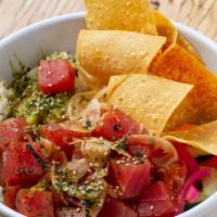 Poke Bowl · Only the freshest tuna poke, served on herb-seasoned rice, fresh greens, and chips