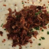 New England Clam Chowder · Red potatoes, clams, garnished with chives and bacon. Gluten Free!