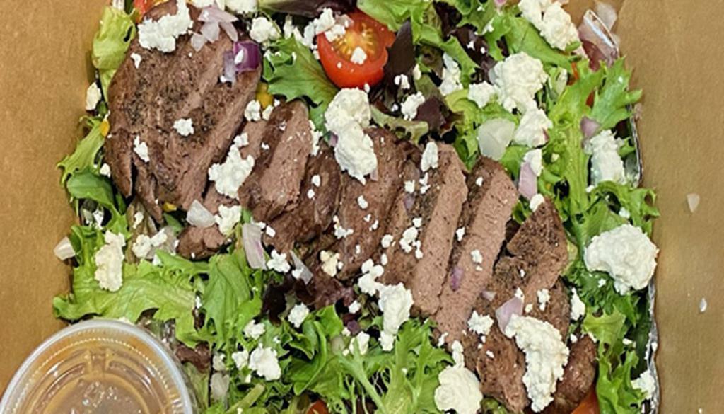Filet Salad · A steak lover's dream! 4 oz. of top choice beef filet, cooked medium-rare, served upon a bed of mixed field greens with goat cheese and cherry tomatoes. Balsamic Vinaigrette dressing recommended. 10g carbs, 3g fiber, 7g net carbs (plus dressing)