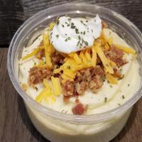 Loaded Msh Rutabaga 8Oz · Mashed Rutabaga topped with bacon bits, cheddar cheese, and sour cream.