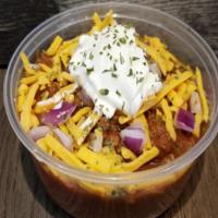 Ajs Loaded Chili 8Oz · AJ's low-carb, bean-less Chili, topped with cheddar cheese, red onions and sour cream.