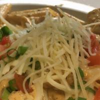 Santa Fe Chkn Pasta · Pasta and chicken sauteed in a lightly spiced cajun cream sauce and topped with tomatoes, mo...