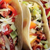 Grilled Chicken Taco · Served with cilantro, onions, and red and green salsas.