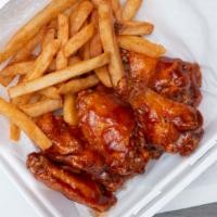 Jerk Fried Wings · 6 Fried Wings tossed in your choice Mild or Jerk Sauce. Served w/ Fries.