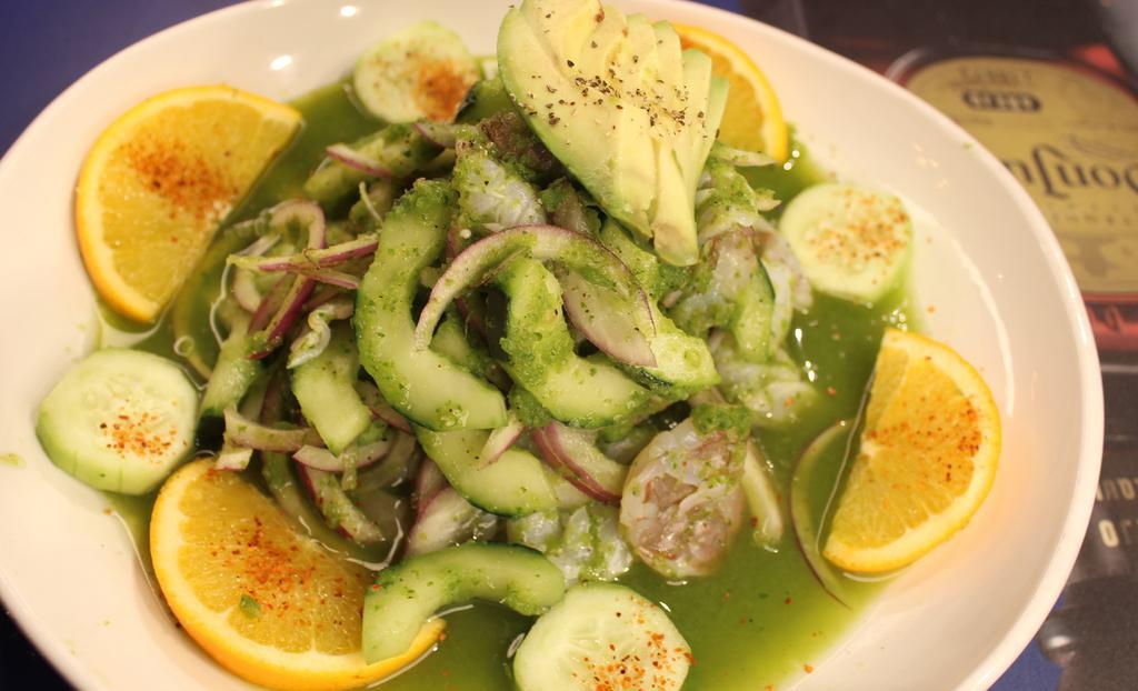 Aguachile Verde · Cooked shrimp on fresh lime juice, lots of purple onions, cucumber on our Chiles verdes sauce.