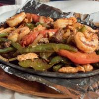Texas Fajita · A delicious combination of steak, shrimp, chicken and Mexican sausage grilled to perfection ...