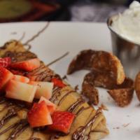 Crepes With Strawberries  · Crepes topped with strawberries and your choice of Caramel or Nutella.