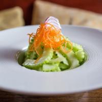 Cucumber Salad · Vegan. Sliced fresh cucumber with sweet vinegar dressing, shallot and carrot garnished.