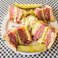 #1. Dinty Moore · Hot corned beef, lettuce, tomato, Russian dressing, triple deck, served on white toast.