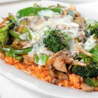 Arroz Con Veggies · A bed of rice with grilled onions mushrooms broccoli zucchini and bell peppers topped with o...