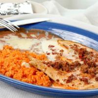Pollo Con Chorizo · Grilled chicken breast topped with chorizo and white cheese sauce. Served with rice, beans a...