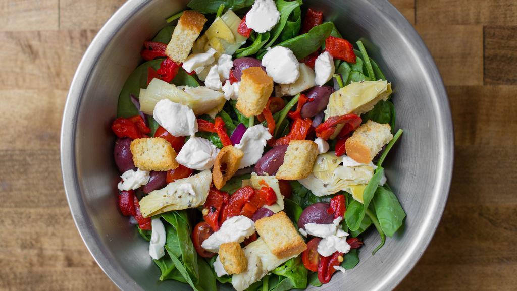 Tuscan · Baby spinach, red onion, mozzarella, artichoke hearts, roasted red peppers, kalamata olives, grape tomatoes, and croutons with tuscan vinaigrette.